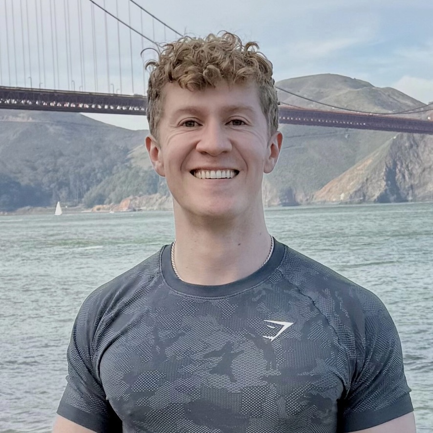 Kevin Boehm smiling by the Golden Gate Bridge